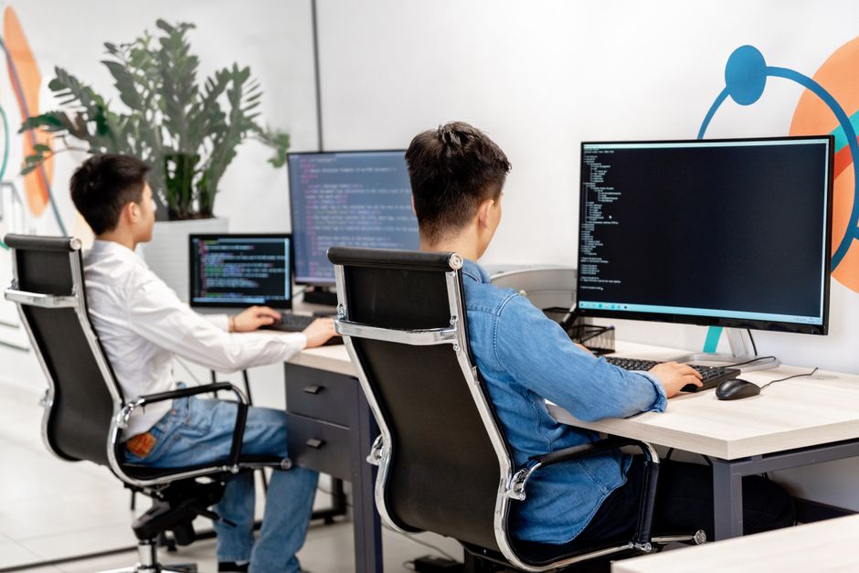 Software developers at work in a modern office
