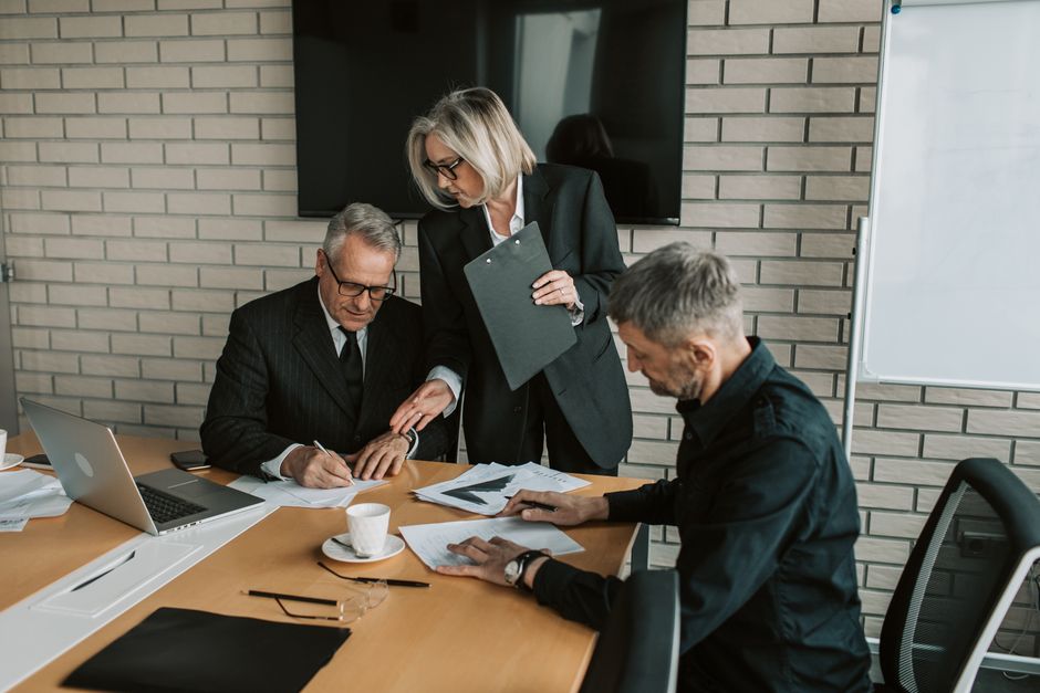 Executives in discussion at a boardroom table