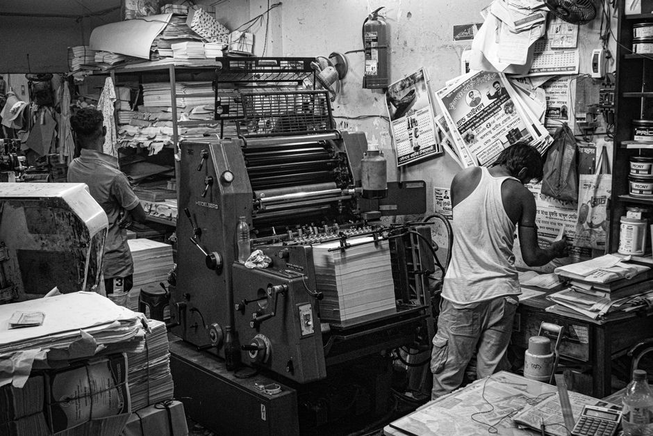 Print shop workers among printing presses